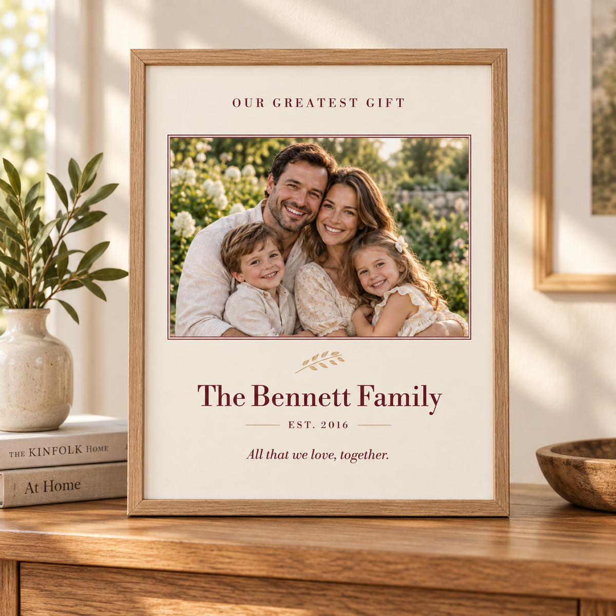Our Greatest Gift personalized family photo print in a natural oak frame, with family name and year.