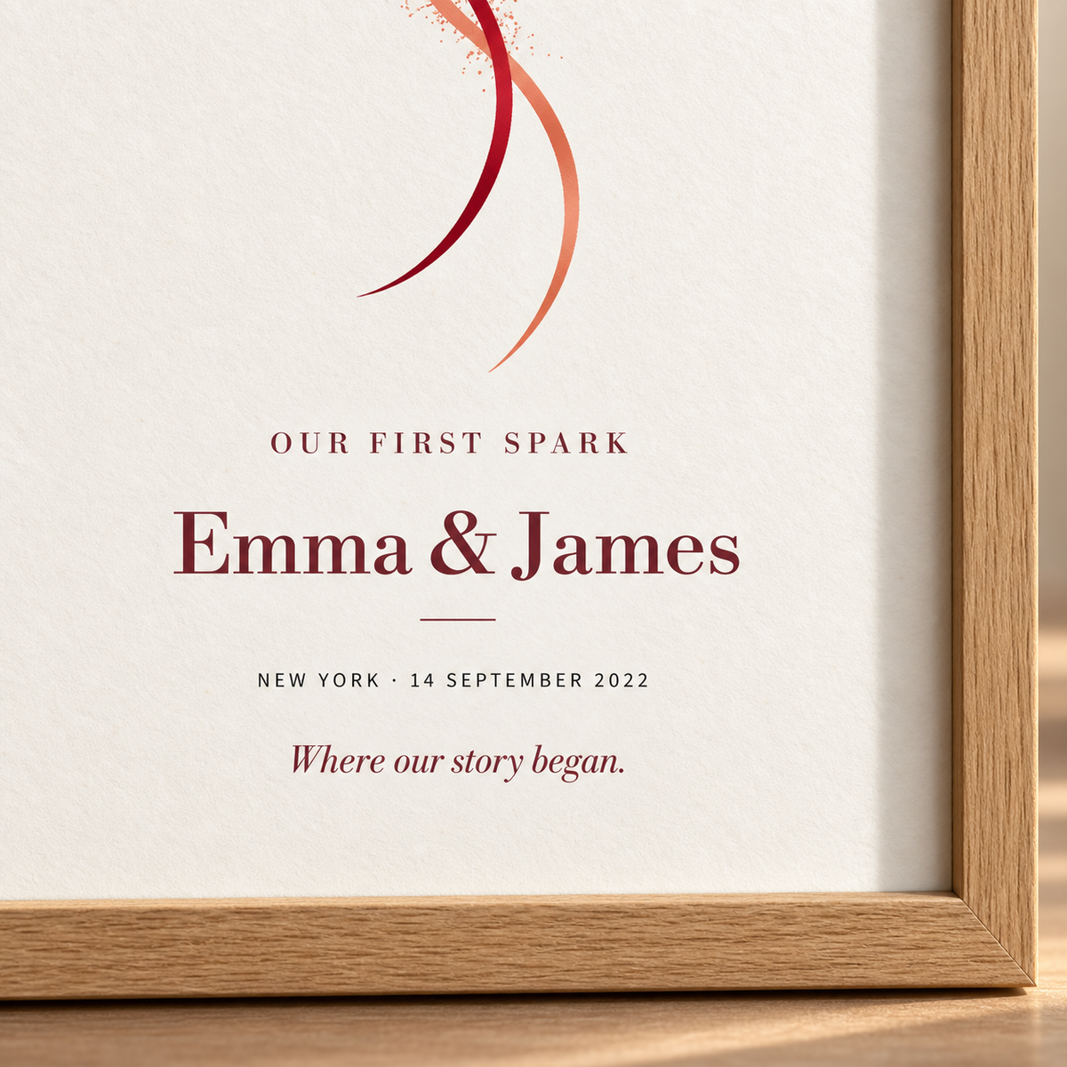 Close-up of Our First Spark personalized names, meaningful date and italic message beside the oak frame corner.