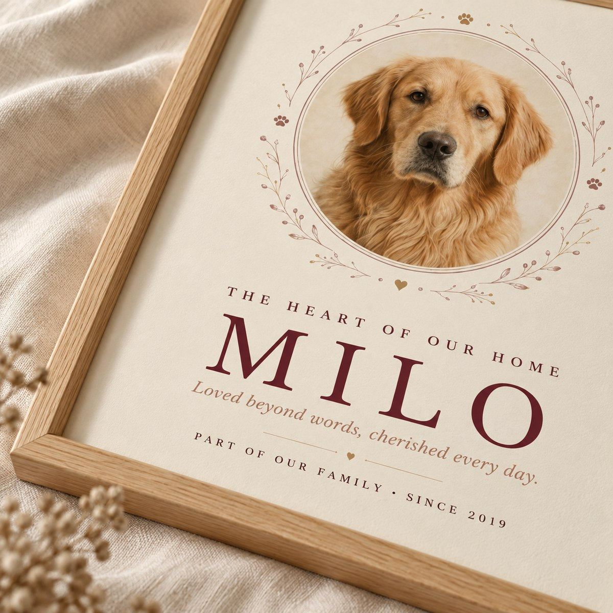 Close-up of a personalized pet print showing the matte artwork and oak frame.