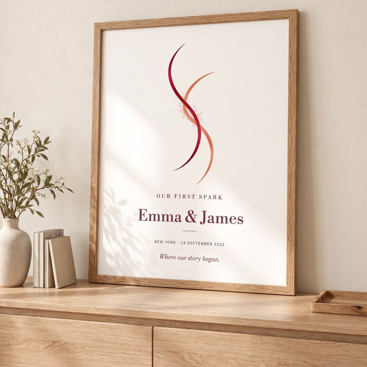 Our First Spark personalized couple artwork displayed in a natural oak frame